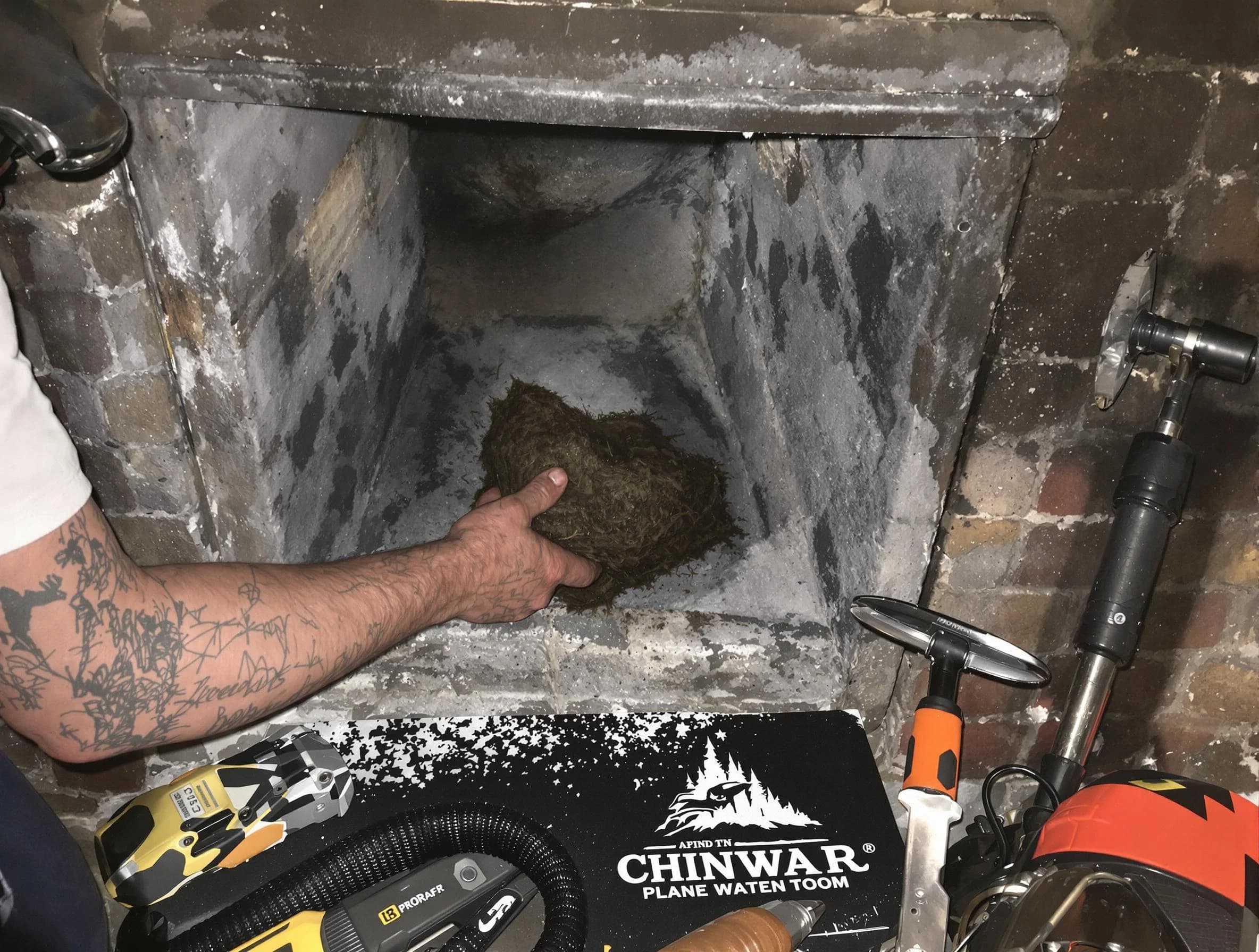 Peabody Chimney Sweep safely removing debris and screening chimney in Peabody, MA
